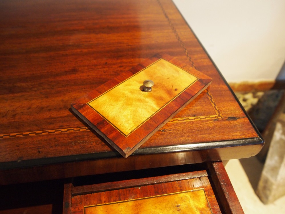 A warm brown Italian timber commode featuring decorative botanical marquetry inlays, two drawers, and square tapered feet. View VIII