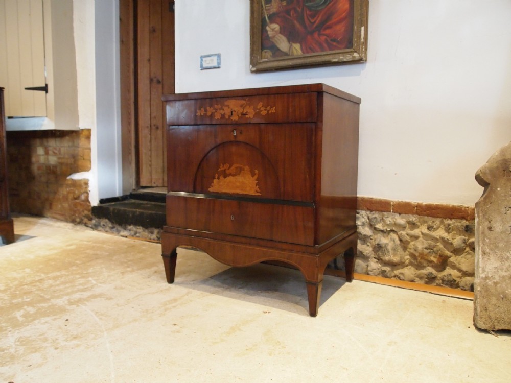 A warm brown Italian timber commode featuring decorative botanical marquetry inlays, two drawers, and square tapered feet. View IX