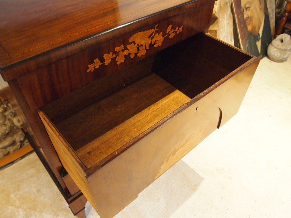 A warm brown Italian timber commode featuring decorative botanical marquetry inlays, two drawers, and square tapered feet. View X