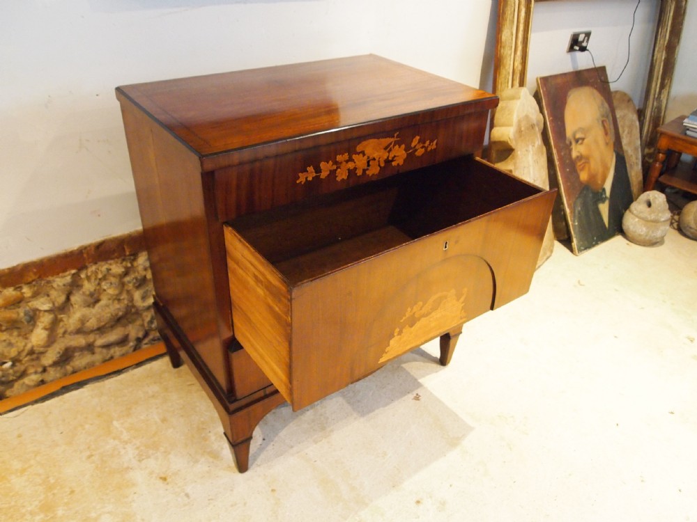 A warm brown Italian timber commode featuring decorative botanical marquetry inlays, two drawers, and square tapered feet. View XVI