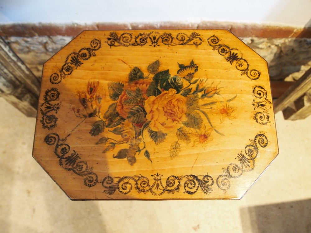 An octagonal Regency satinwood tilt-top table featuring hand-painted floral artwork on a slender turned column and tripod base. View XV