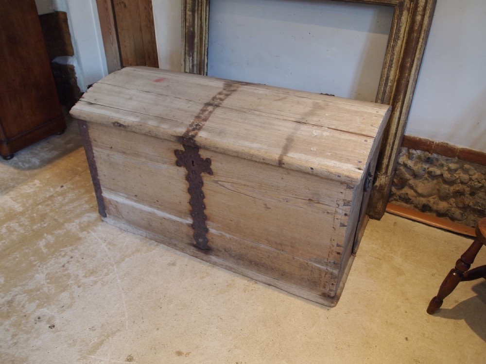 An eighteenth-century Scandinavian pine marriage chest featuring a domed lid, wrought iron corner brackets, and a central decorative iron escutcheon plate. View VIII
