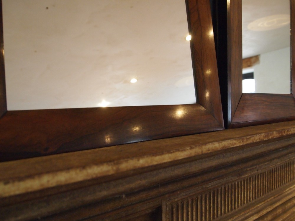 A trio of rectangular Regency period mirrors featuring dark rosewood frames with wide moulded borders. View IV