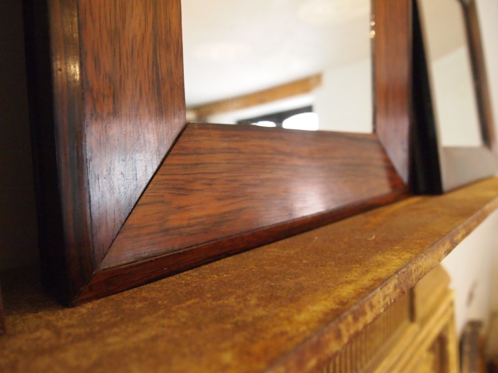 A trio of rectangular Regency period mirrors featuring dark rosewood frames with wide moulded borders. View VII