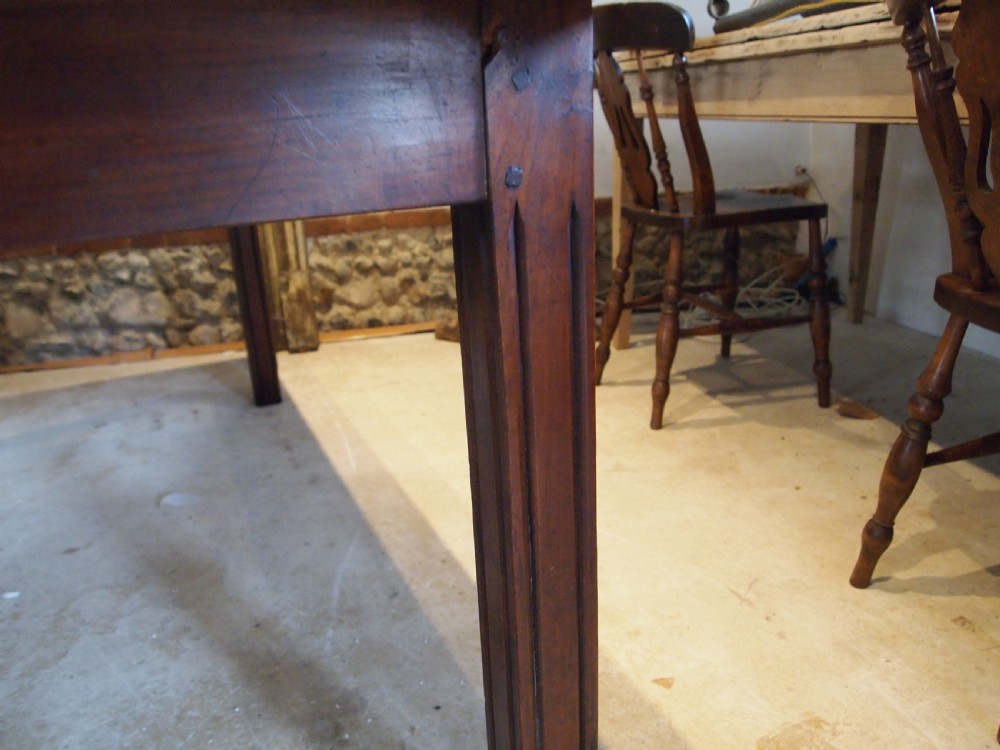 A 19th-century French cherry wood refectory dining table with a plank top and fluted square legs. View V