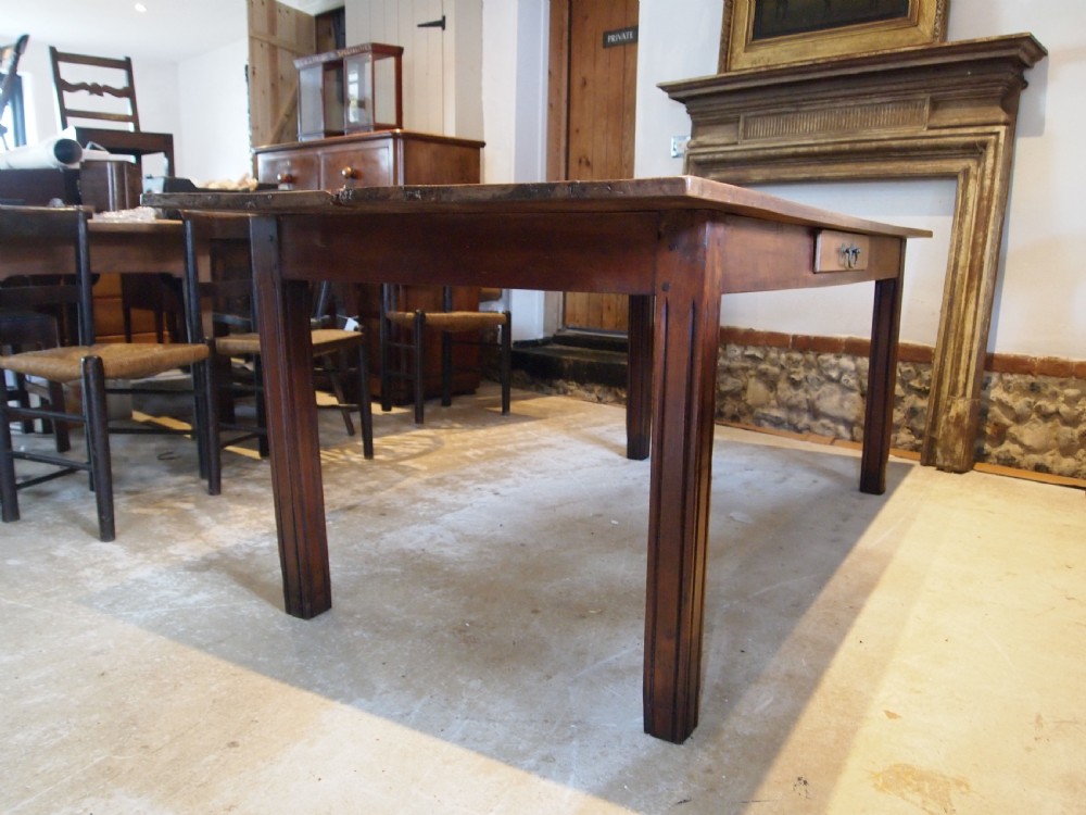 A 19th-century French cherry wood refectory dining table with a plank top and fluted square legs. View VII