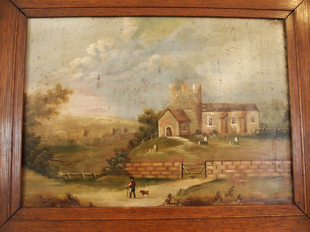 A 19th-century naive oil painting on board depicting a rural church scene with a figure walking a dog, set within a wide wooden frame. View II