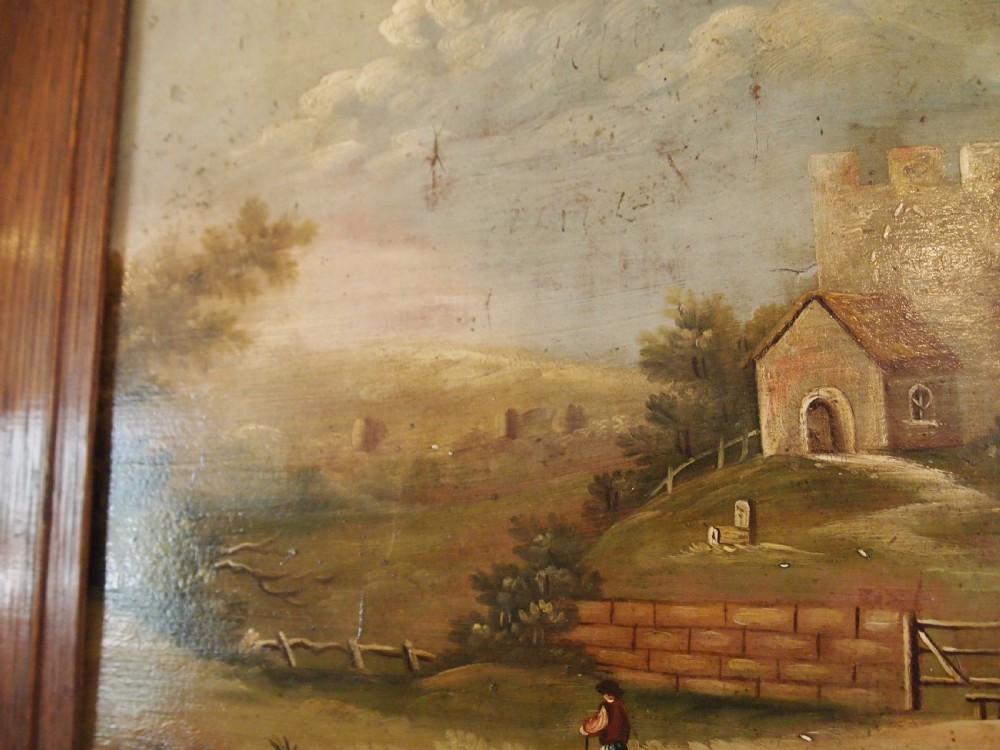 A 19th-century naive oil painting on board depicting a rural church scene with a figure walking a dog, set within a wide wooden frame. View VII