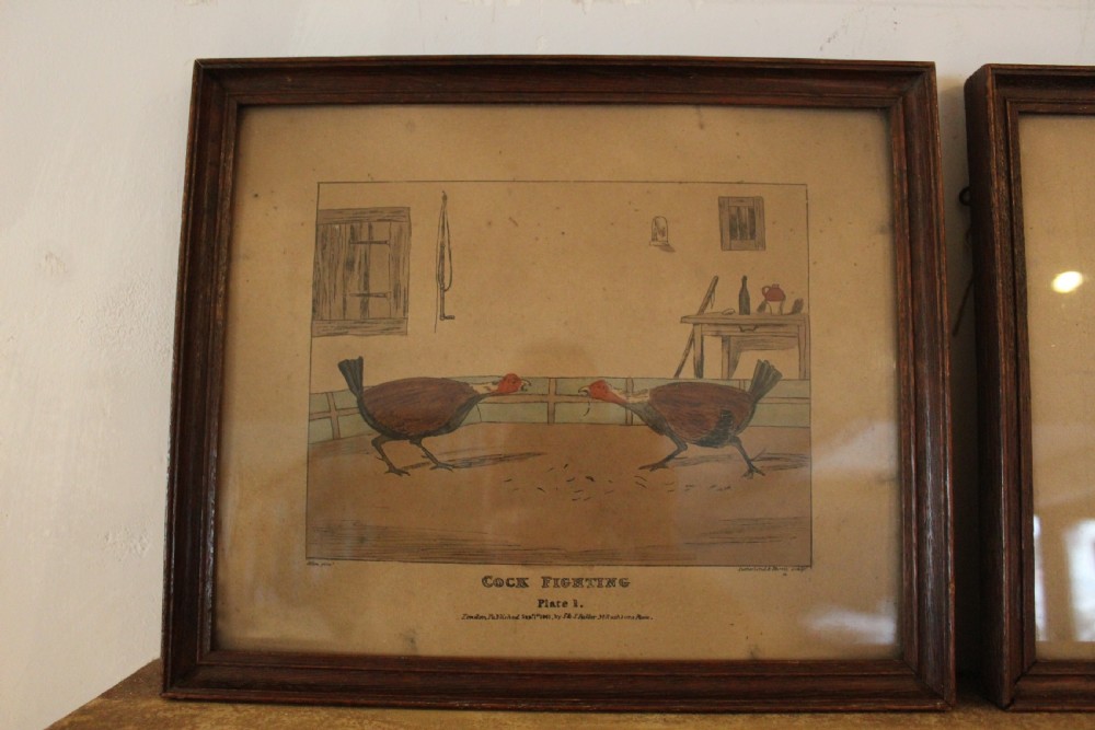 A set of four framed Victorian aquatint prints depicting cockfighting scenes in matching dark wood frames. View II