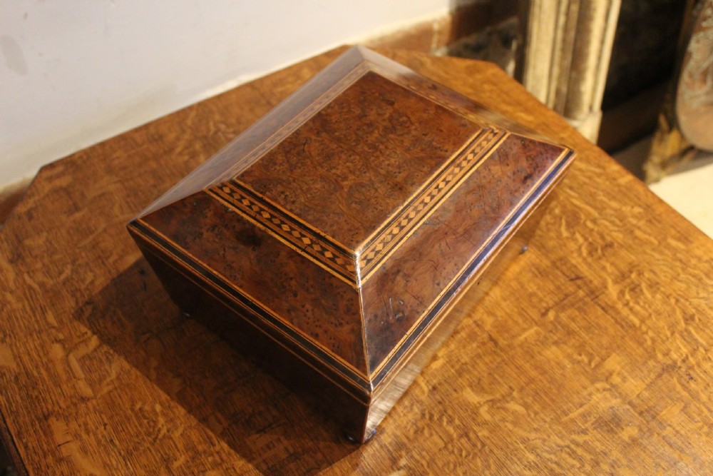 A nineteenth-century Regency period burr yew wooden jewellery box with geometric marquetry banding and a diamond escutcheon. View II