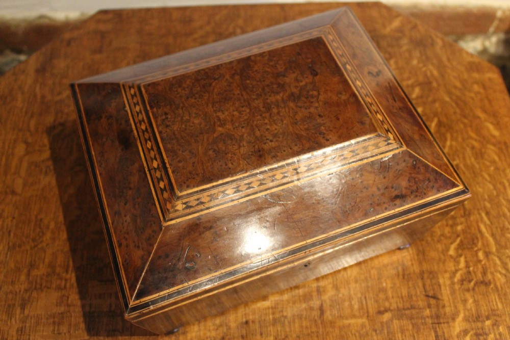 A nineteenth-century Regency period burr yew wooden jewellery box with geometric marquetry banding and a diamond escutcheon. View IV