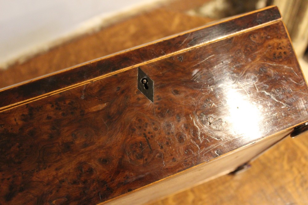 A nineteenth-century Regency period burr yew wooden jewellery box with geometric marquetry banding and a diamond escutcheon. View VI
