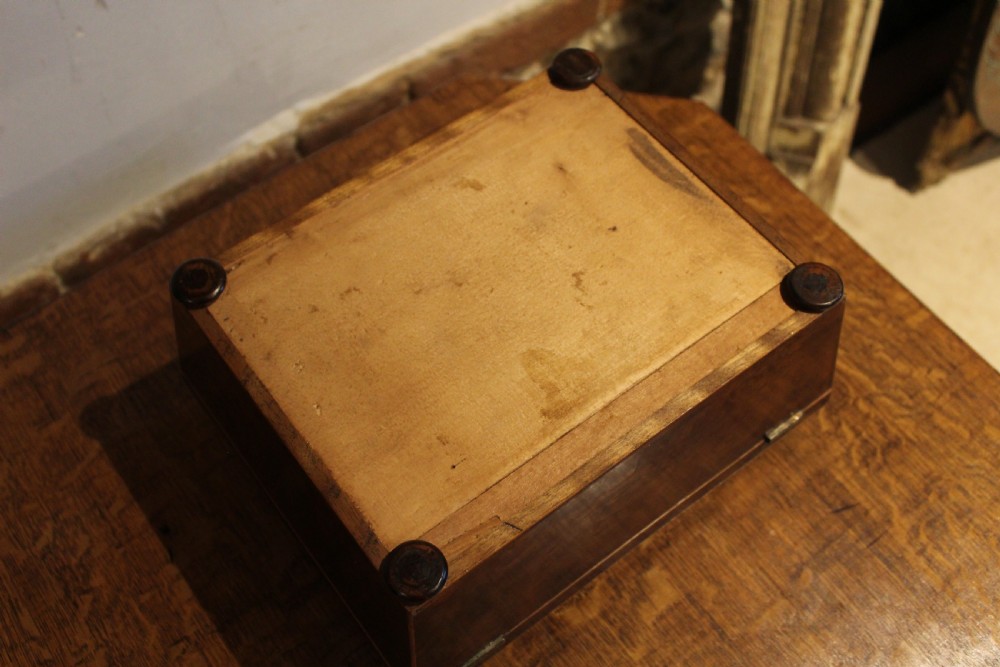 A nineteenth-century Regency period burr yew wooden jewellery box with geometric marquetry banding and a diamond escutcheon. View IX