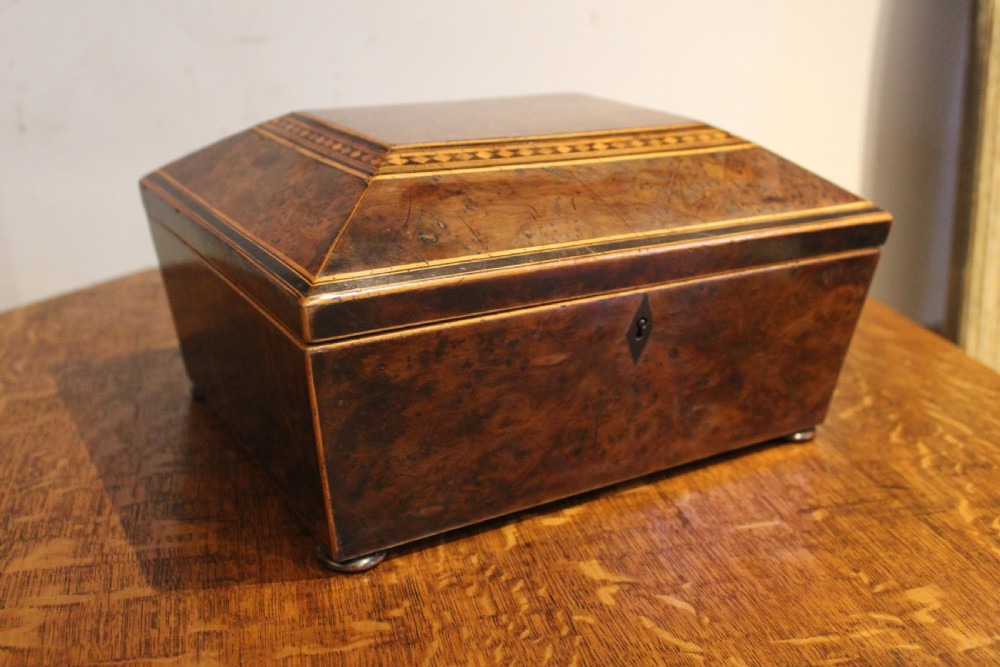 A nineteenth-century Regency period burr yew wooden jewellery box with geometric marquetry banding and a diamond escutcheon. View XI