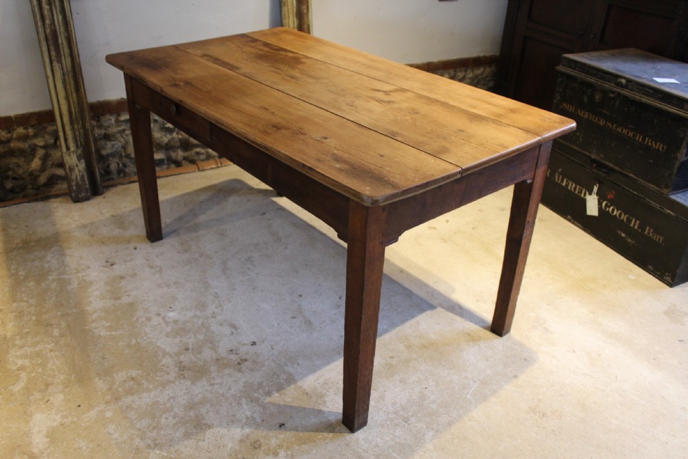 A rectangular Victorian solid oak refectory dining table with a plank top and tapered square legs. View V