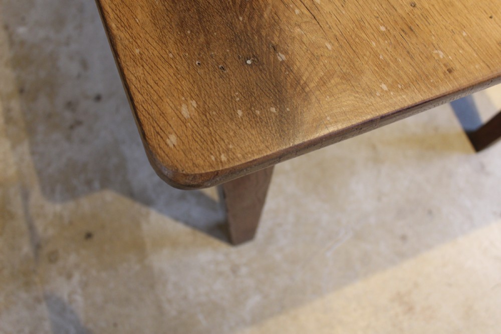 A rectangular Victorian solid oak refectory dining table with a plank top and tapered square legs. View IX