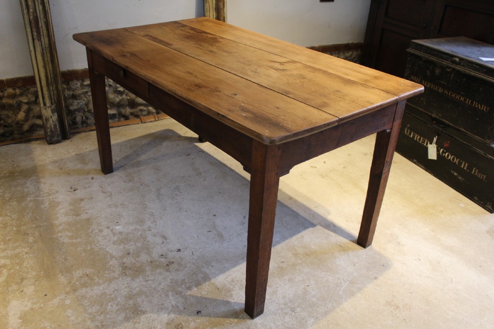 A rectangular Victorian solid oak refectory dining table with a plank top and tapered square legs. View X