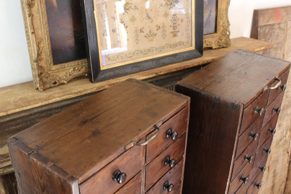 A pair of dark brown Victorian pine specimen cabinets, each featuring twin columns of eight small drawers fitted with turned wooden handles. View III