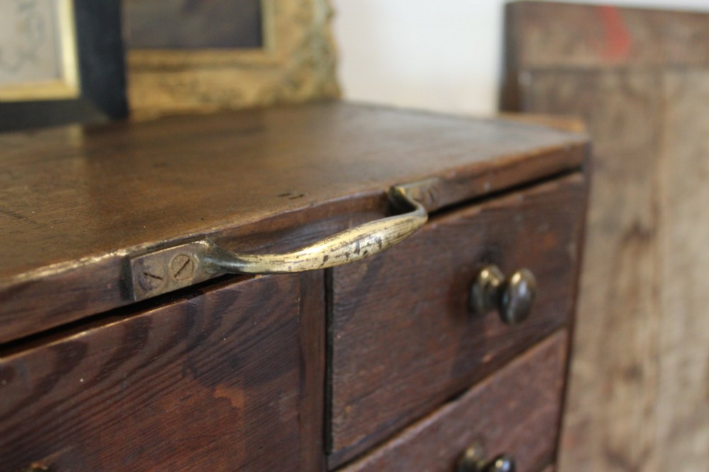 A pair of dark brown Victorian pine specimen cabinets, each featuring twin columns of eight small drawers fitted with turned wooden handles. View IV