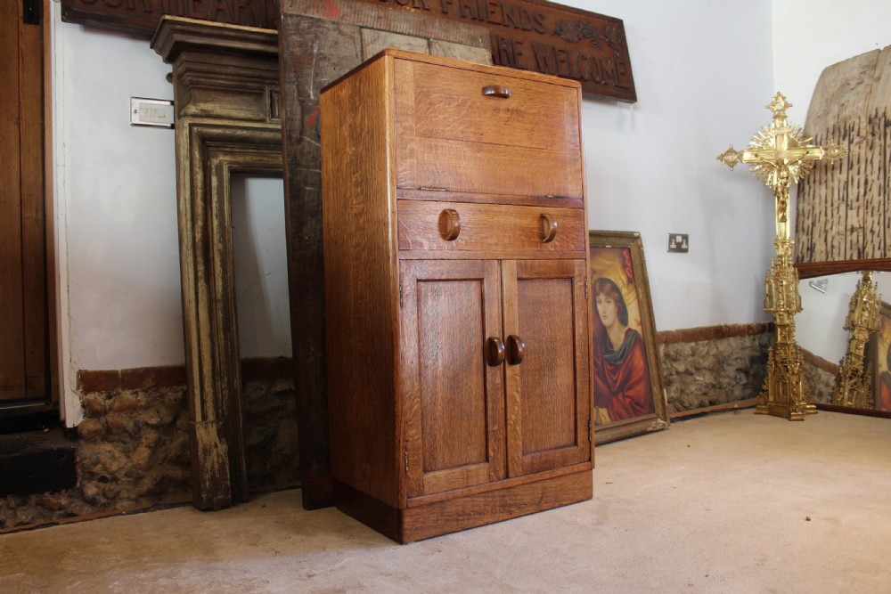 Heals Arts and Crafts Oak tallboy cupboard c1920