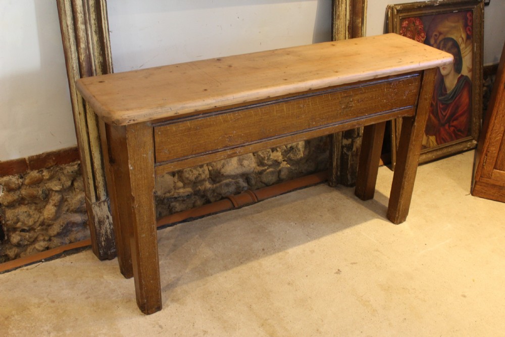 A Victorian wooden console table featuring a light pine top set upon a dark oak frame with square legs. View II