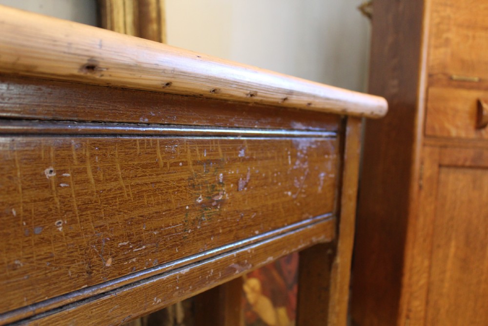 A Victorian wooden console table featuring a light pine top set upon a dark oak frame with square legs. View IV