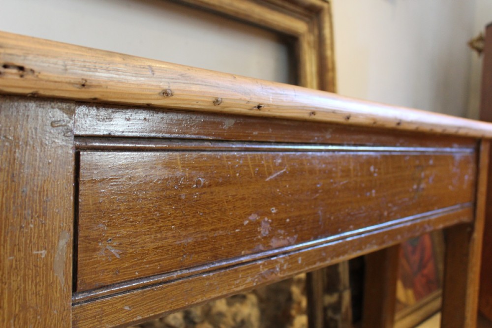 A Victorian wooden console table featuring a light pine top set upon a dark oak frame with square legs. View X