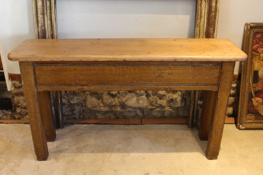 A Victorian wooden console table featuring a light pine top set upon a dark oak frame with square legs. View XI