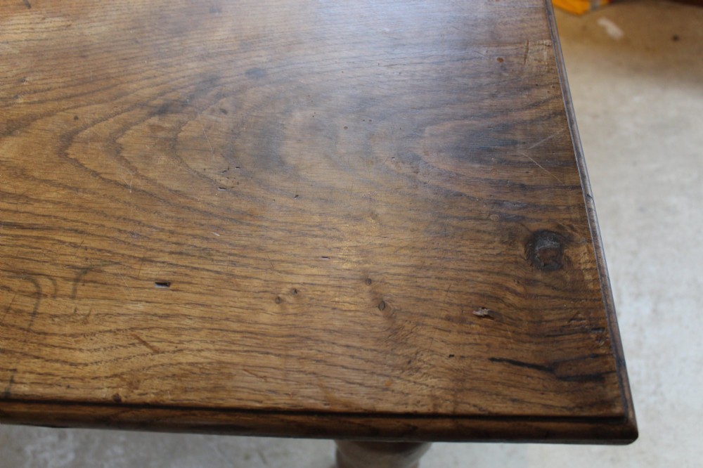 A large Edwardian oak refectory dining table with a rectangular plank top and sturdy turned legs. View V