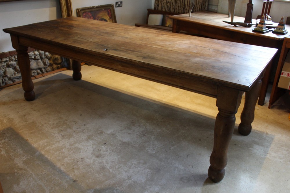 A large Edwardian oak refectory dining table with a rectangular plank top and sturdy turned legs. View VI