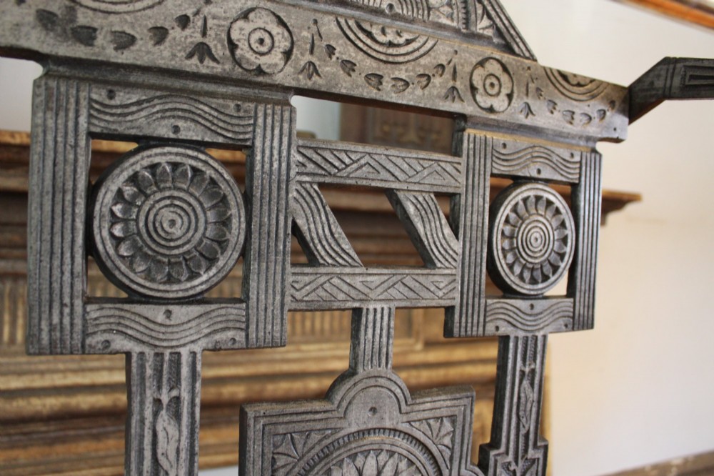 A Victorian cast iron stick stand featuring intricate geometric lattice patterns, a central floral rosette medallion, and a brass top rail over a rectangular drip tray. View II