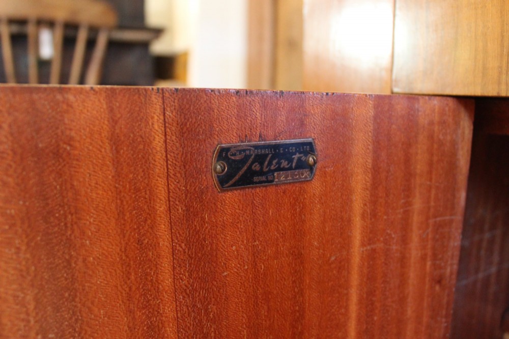 An Art Deco walnut bureau featuring a fall-front writing compartment above a single drawer and a two-door cupboard. View VIII