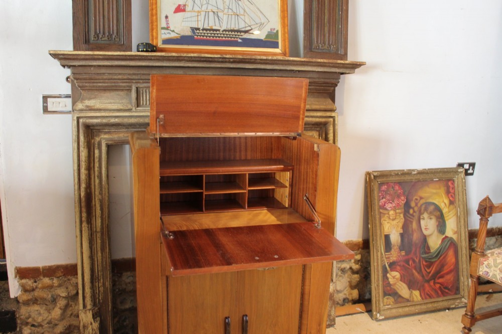 An Art Deco walnut bureau featuring a fall-front writing compartment above a single drawer and a two-door cupboard. View XI