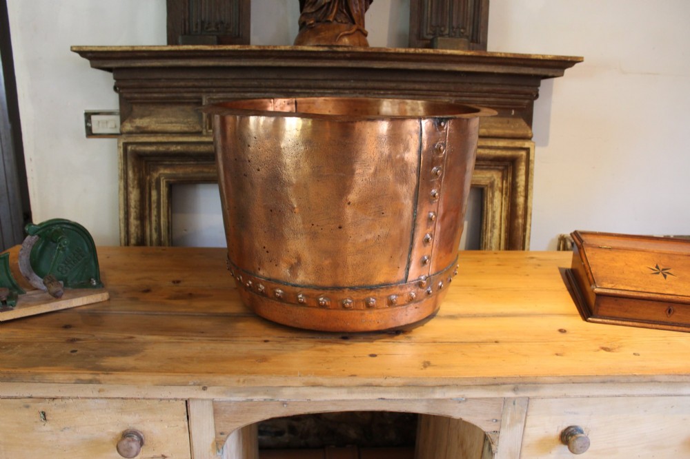 A large nineteenth-century Victorian copper vessel featuring a flared rolled rim and a hand-riveted vertical seam. View II