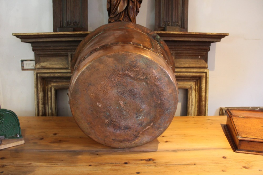 A large nineteenth-century Victorian copper vessel featuring a flared rolled rim and a hand-riveted vertical seam. View VII