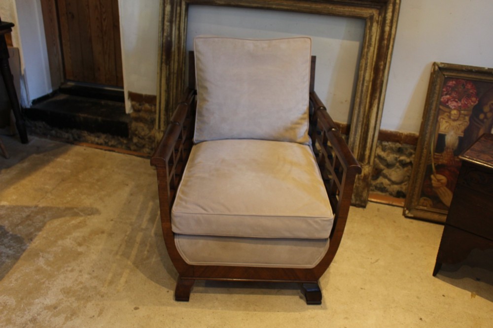 An Art Deco solid walnut armchair featuring grid-pattern side panels, squared feet, and beige suede seat and back cushions. View III