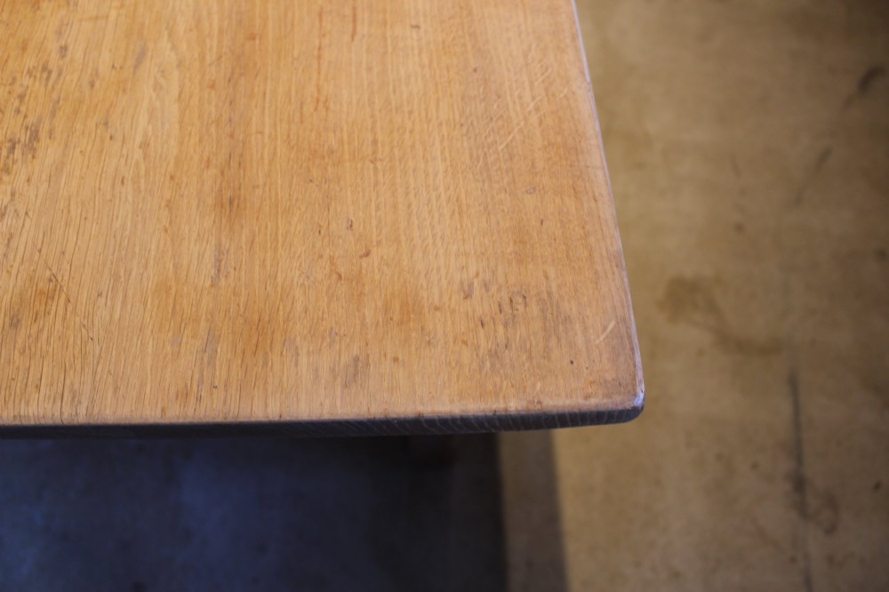 An Edwardian light oak farmhouse refectory dining table featuring straight square legs and a spacious rectangular plank top. View II
