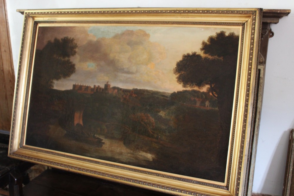 A large 18th-century oil painting on canvas depicting a landscape view of Windsor Castle across a river with a small sailing vessel, held in a beaded giltwood frame. View IX