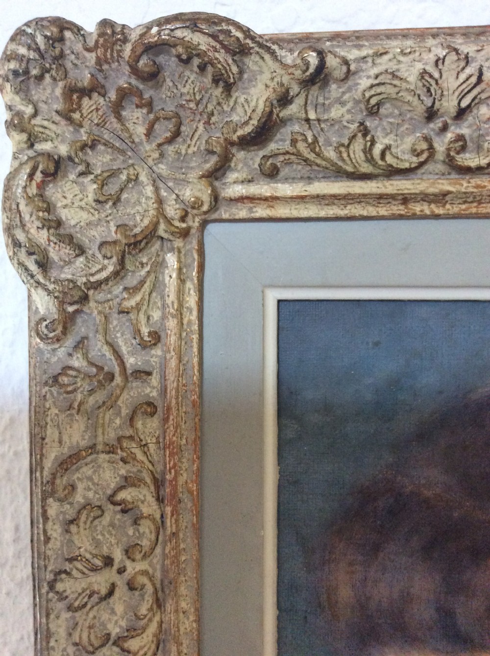 A profile portrait painting of a young French girl with fringe hair, presented in an ornate gilt scrollwork frame. View II