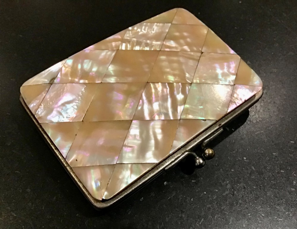 A rectangular Victorian card case featuring an iridescent mother of pearl diamond mosaic pattern and a metal frame. View III