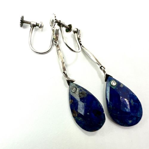 fig 1. A pair of Art Deco silver screwback drop earrings featuring faceted blue teardrop stones suspended from linear marcasite-set bars.