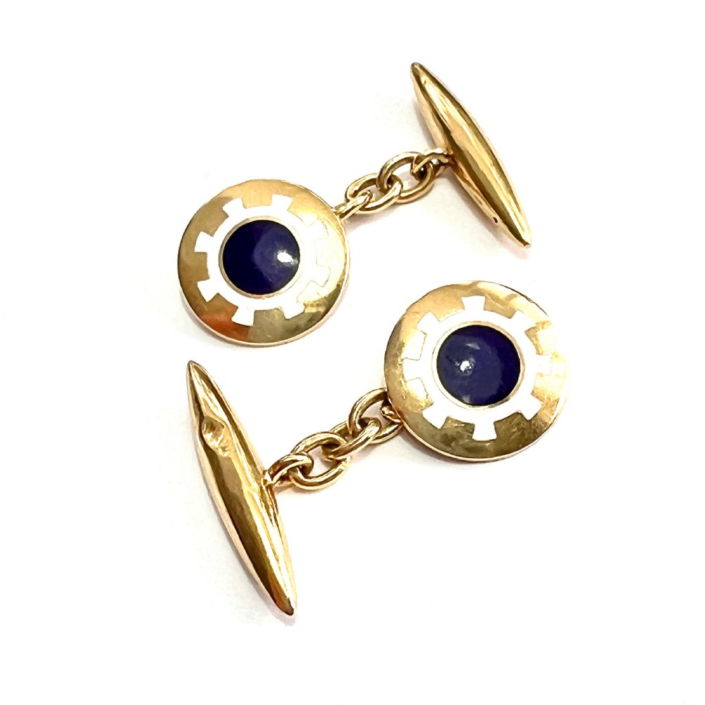 A pair of antique 18ct yellow gold chain-link cufflinks featuring circular faces decorated with central blue enamel discs surrounded by white enamel borders and connected to torpedo-shaped backs.