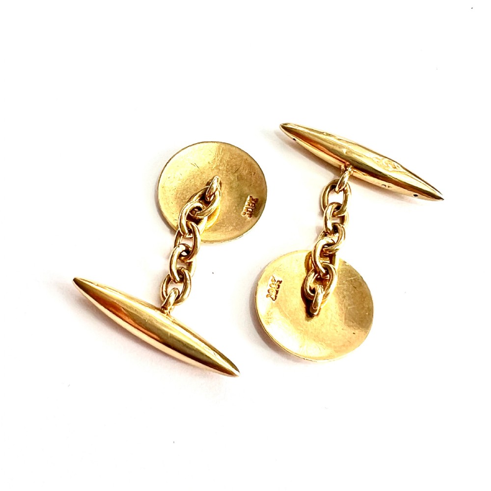 A pair of antique 18ct yellow gold chain-link cufflinks featuring circular faces decorated with central blue enamel discs surrounded by white enamel borders and connected to torpedo-shaped backs. View IV