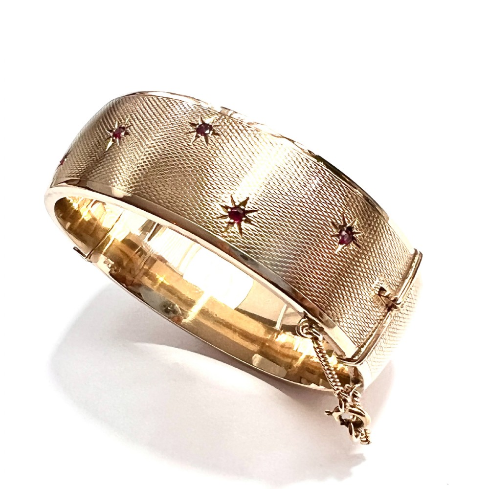 Vintage 1961 Ruby Star Gold Bangle by Cropp & Farr View IX