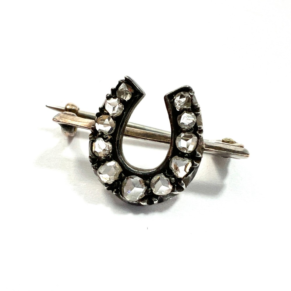 Tiny Victorian Diamond Horseshoe Brooch in Gold and Silver