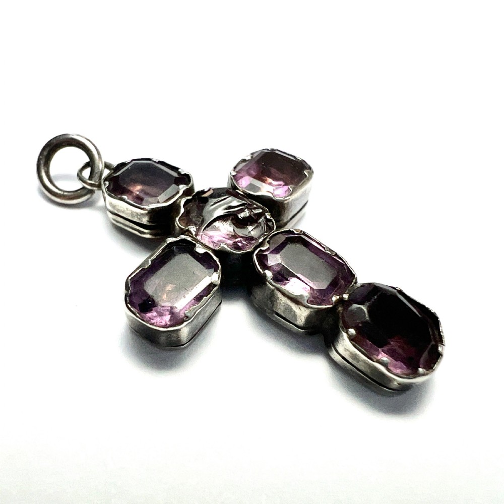 A Georgian silver cross pendant set with six foil-backed faceted purple amethyst gemstones in crimped collet settings. View III