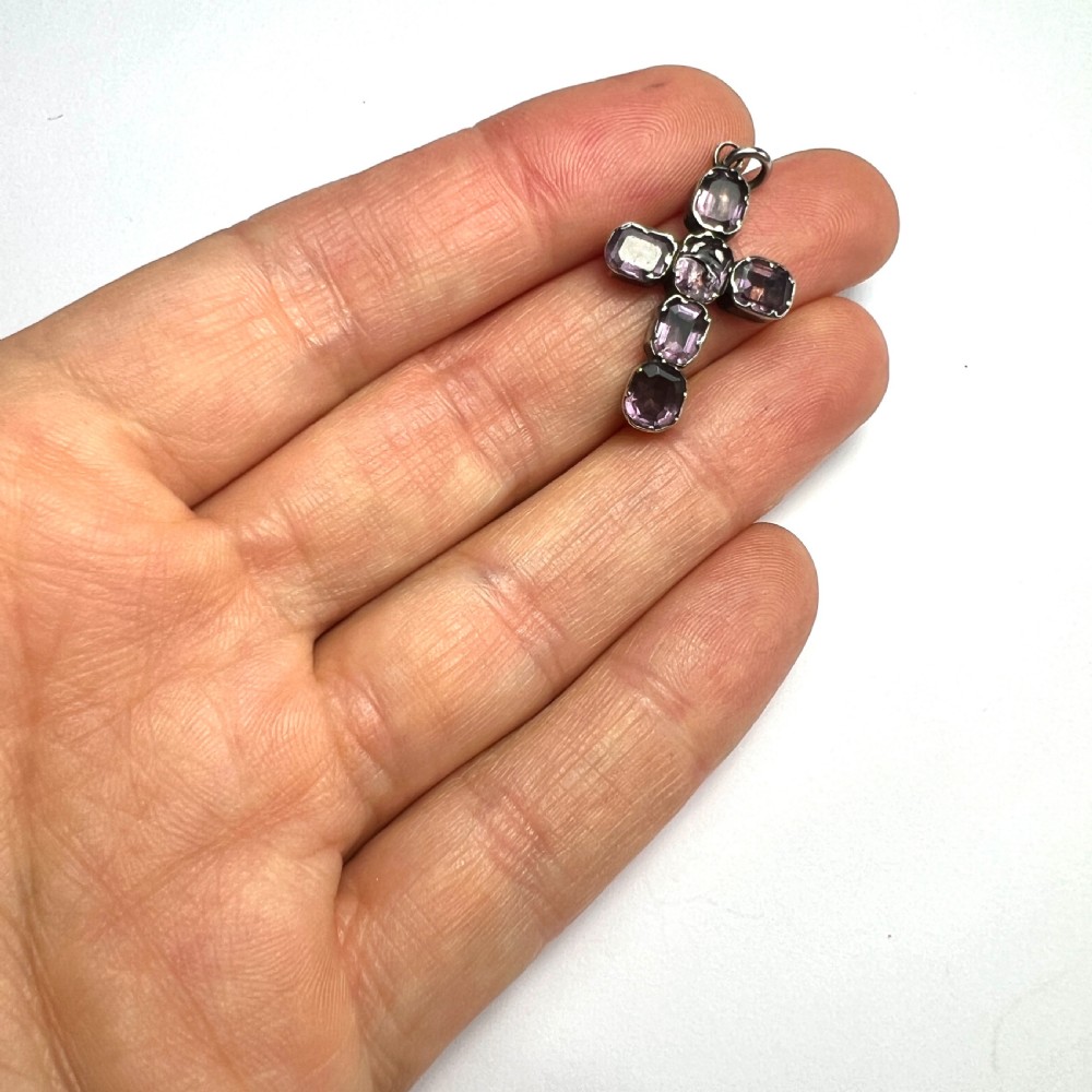 A Georgian silver cross pendant set with six foil-backed faceted purple amethyst gemstones in crimped collet settings. View VI