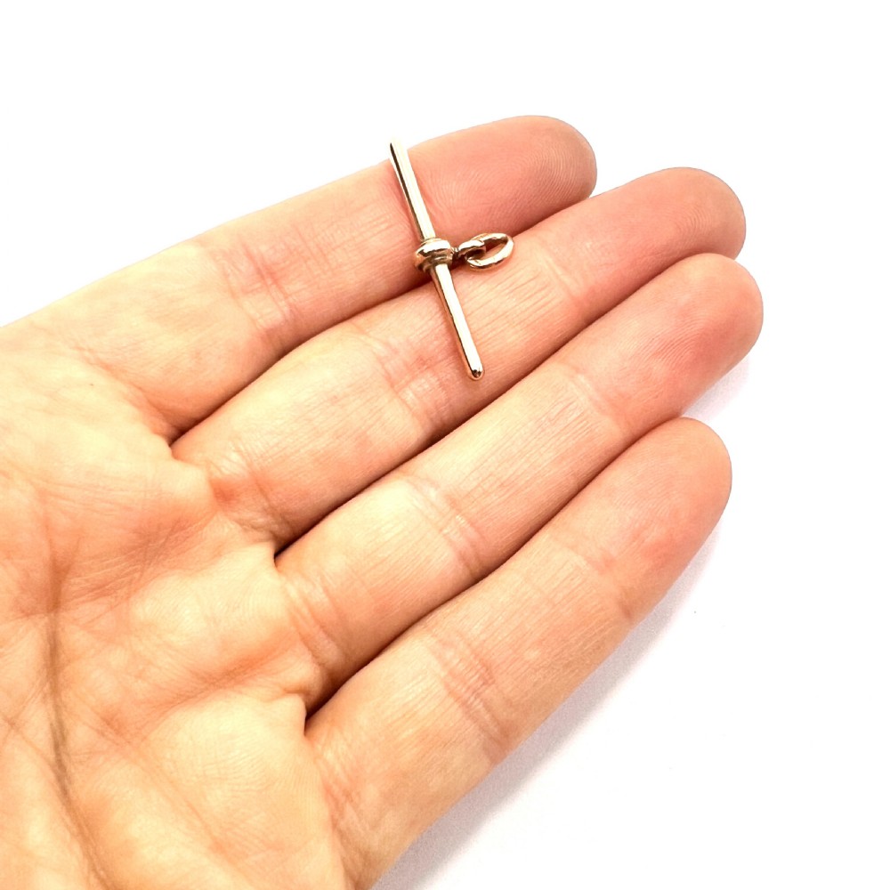 A polished 9ct rose gold Victorian albert T-bar pendant features a central crossbar and an attached jump ring. View VII