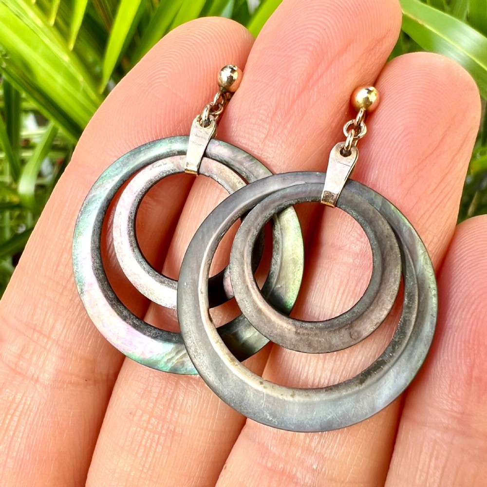 Pair of Art Deco 9ct gold screwback drop earrings featuring concentric mother of pearl hoop pendants. View VI