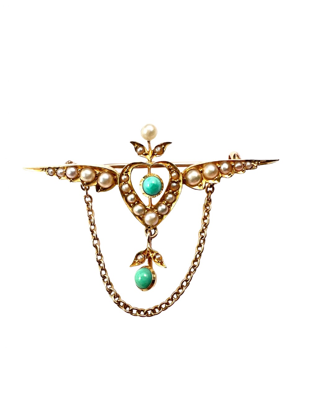 An Edwardian 15ct gold brooch featuring a winged heart motif set with seed pearls and turquoise cabochons with a draped lower chain. View V